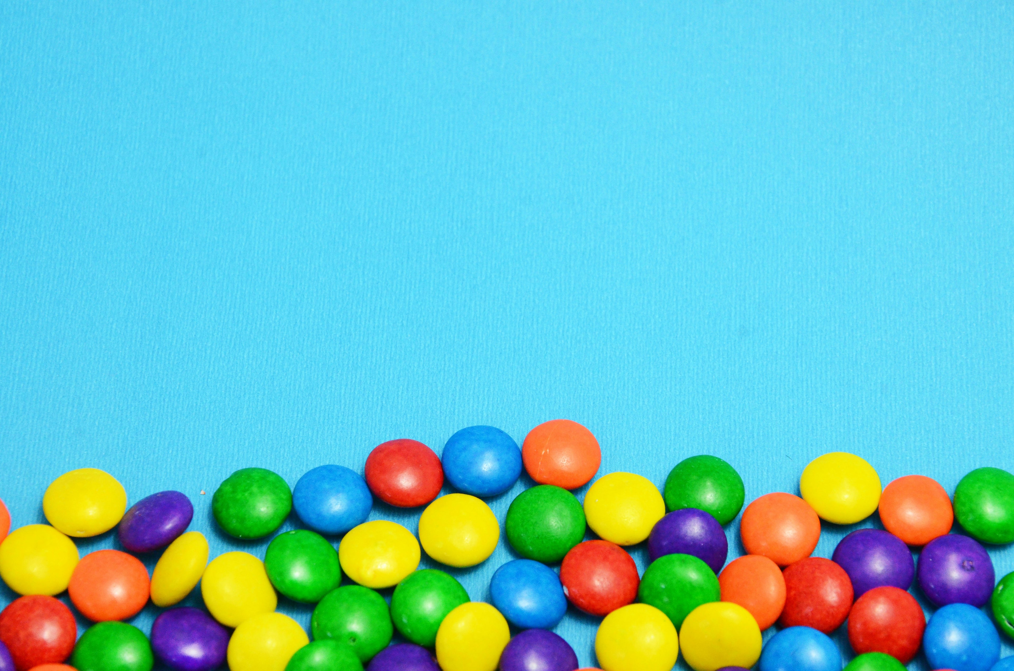 Colorful candies on a blue background