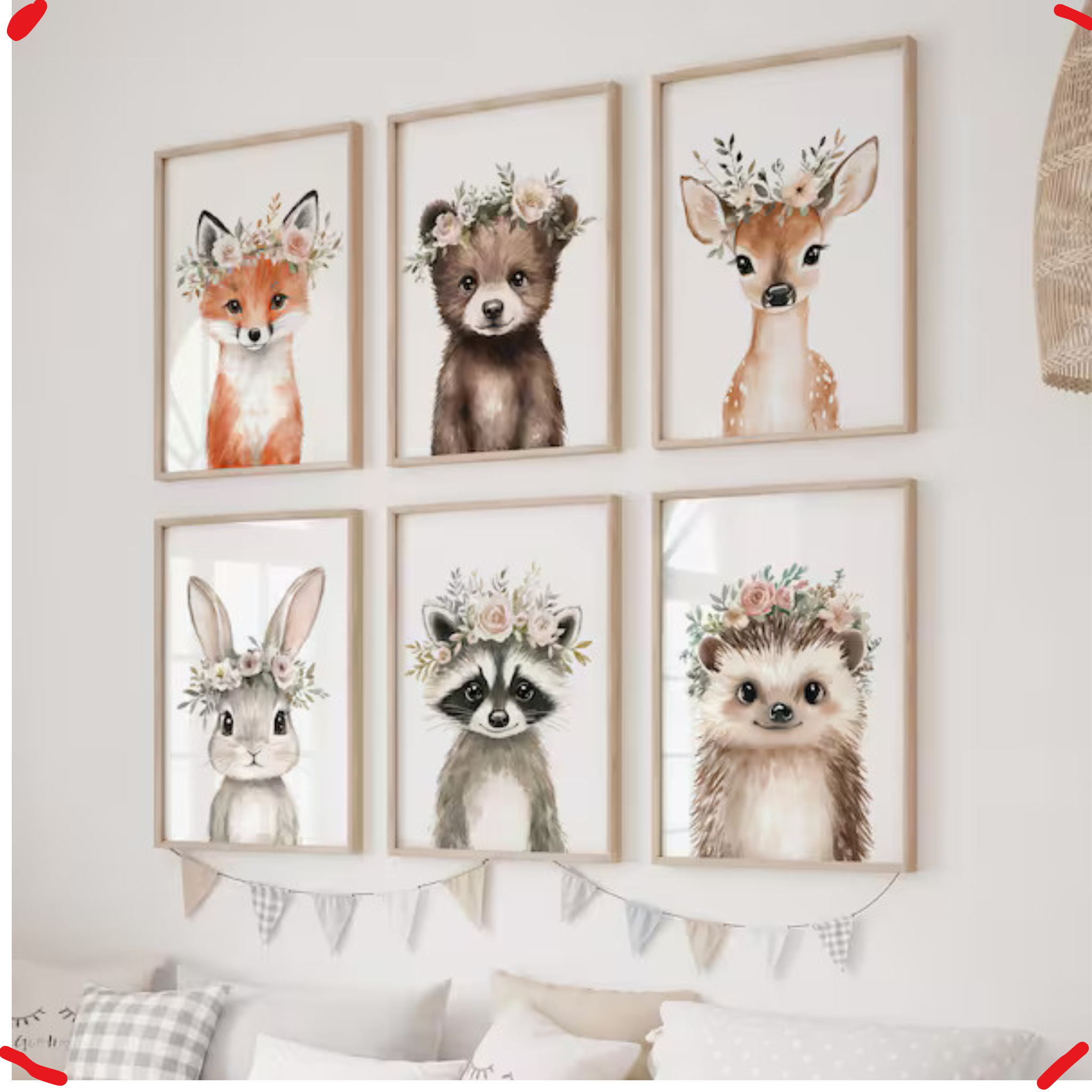Set of six framed animal prints with floral crowns on a wall.